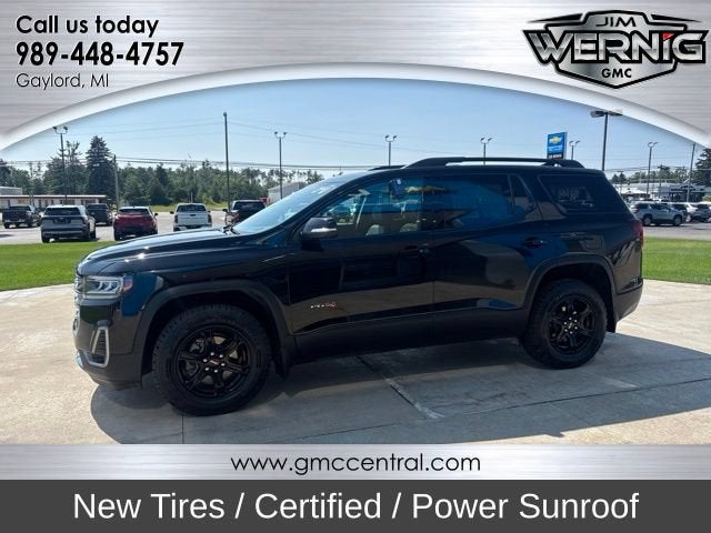 2022 GMC Acadia AT4 in Ebony Twilight Metallic — front three-quarter view