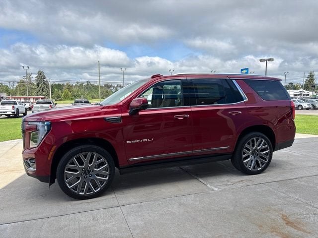 2026 GMC Yukon Denali Ultimate in Volcanic Red Tintcoat — front three-quarter view