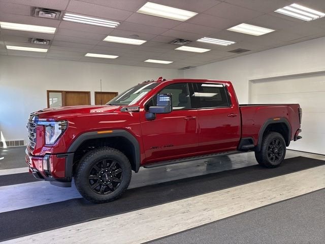 2026 GMC Sierra 3500 HD AT4 in Volcanic Red Tintcoat — front three-quarter view