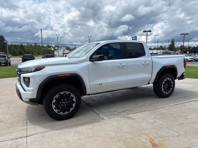 2026 GMC Canyon AT4 in Summit White — front three-quarter view