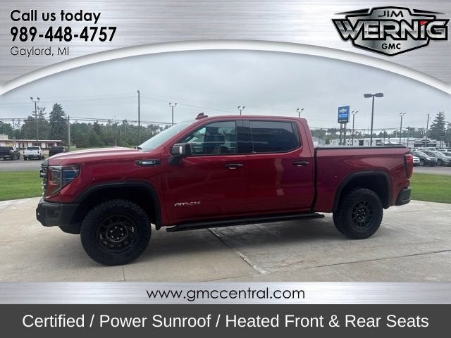 2024 GMC Sierra 1500 AT4X in Volcanic Red Tintcoat — front three-quarter view